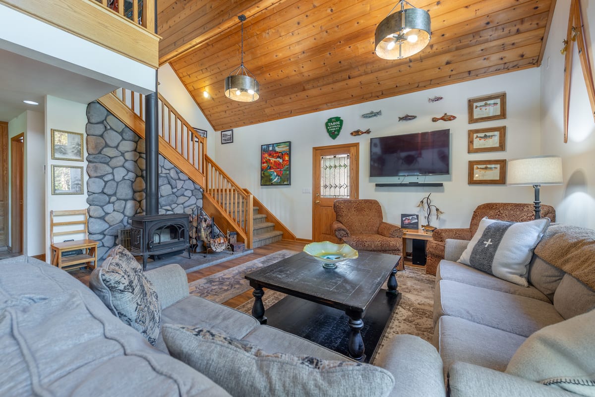Second floor living room gives access to third floor loft, full bathroom, bunk room and top king bedroom with its own Juliet deck.