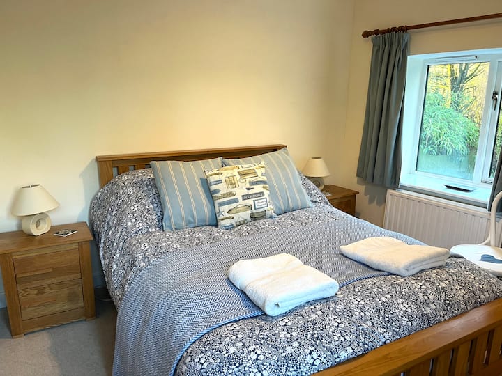 Bedroom one. Double bed and wardrobe. Hair dryer supplied. Guests are supplied with one large towel and a hand towel.