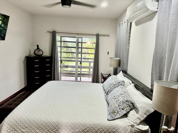 Main bedroom with balconies and sea views. 