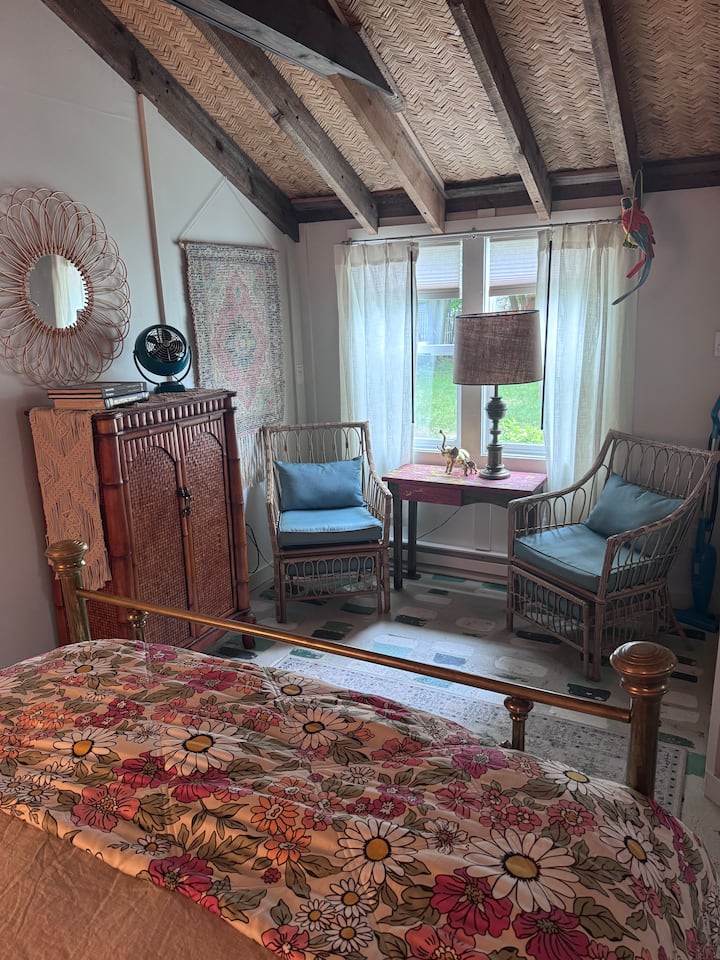 The bedroom has a little sitting area too.