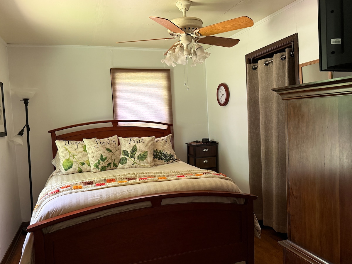 Queen size bed with a super comfortable mattress pad. 