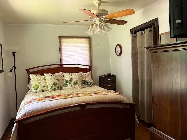 Queen size bed with a super comfortable mattress pad. 