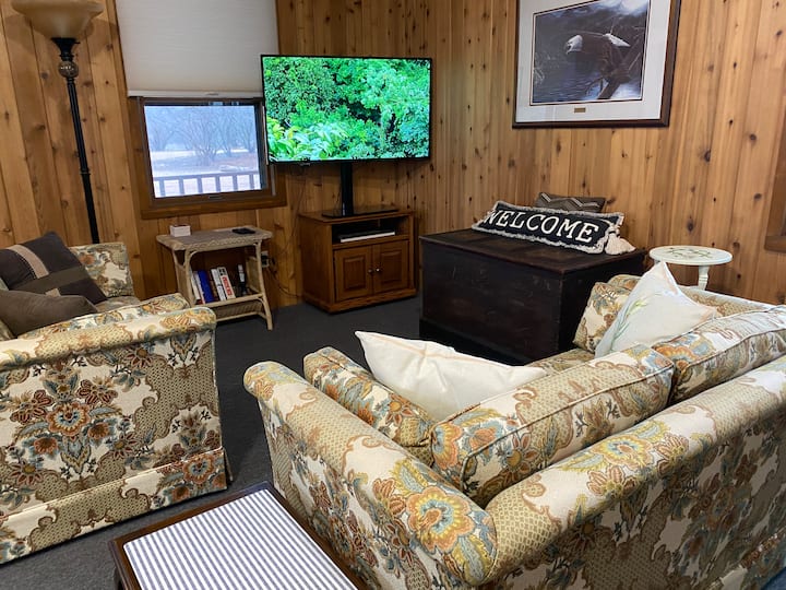 Sitting area to watch television in the Big Room. There is a fan in the center of the ceiling. 