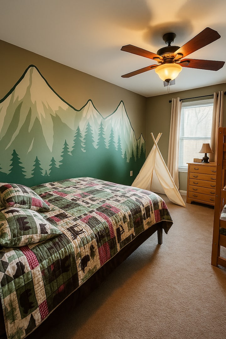 The Wilderness kids room with twin bunk beds and full sized queen bed.