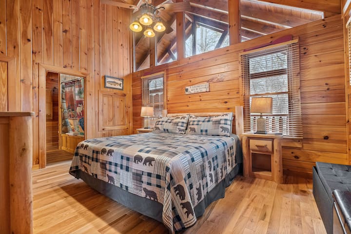 First King Bedroom with King Bed, TV, private ensuite, private exit to wrap around porch and hot tub.