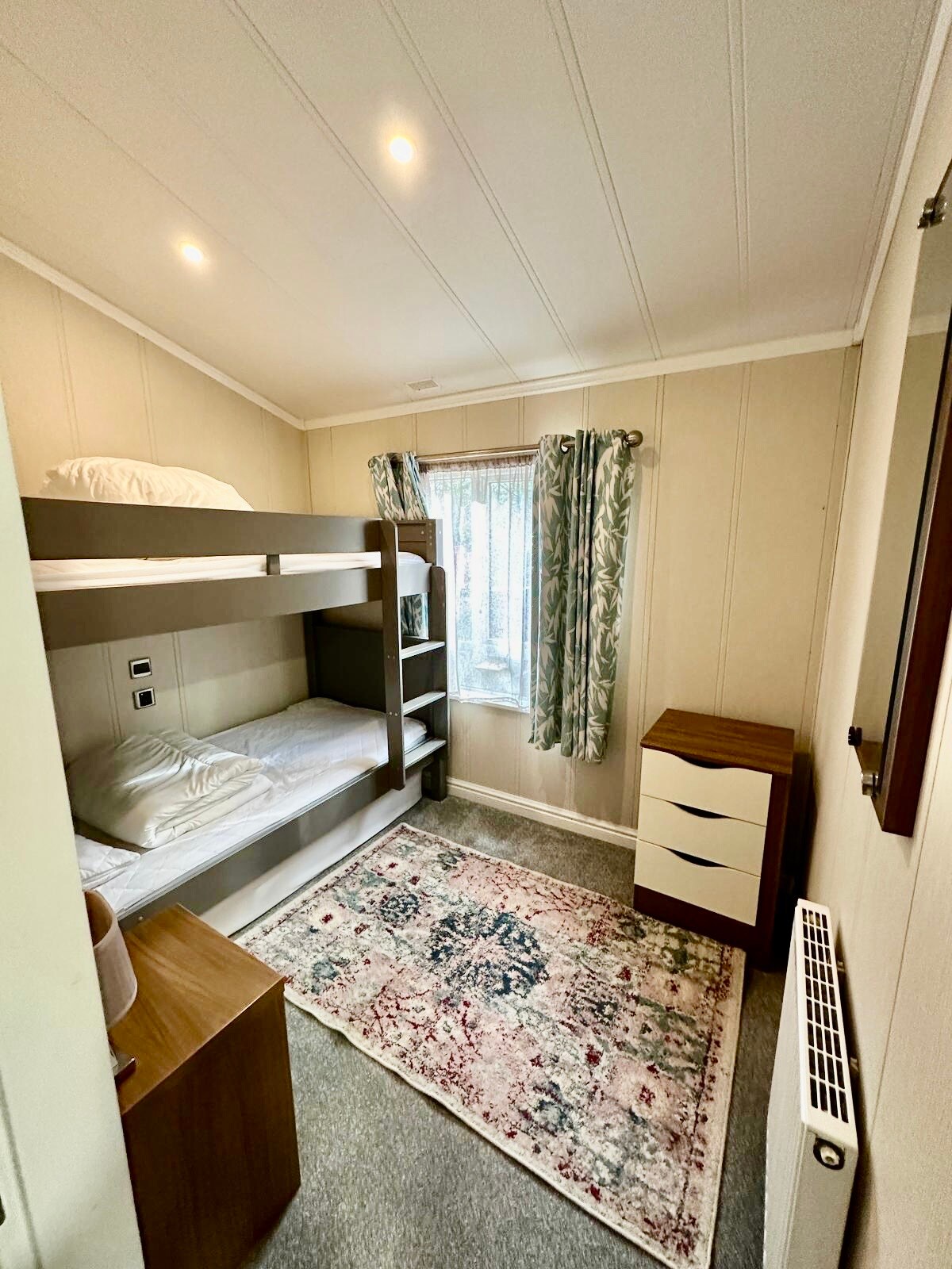 Adult size bunks and a single mattress for a 3rd person