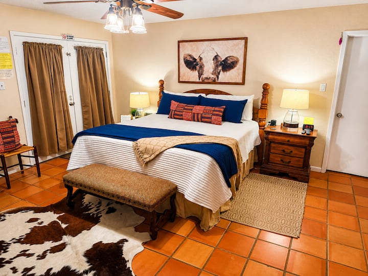 Main bedroom features king sized bed and Twin daybed with a roll out trundle tucked beneath. Also 2 Twin Rollaway Bed (stored in master closet).