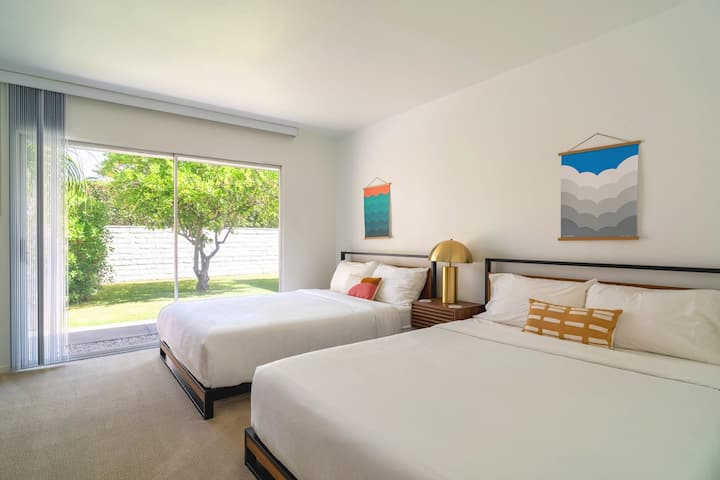 Bedroom 4 updated with two queen beds and ensuite bathroom with shower. Opens onto courtyard garden.