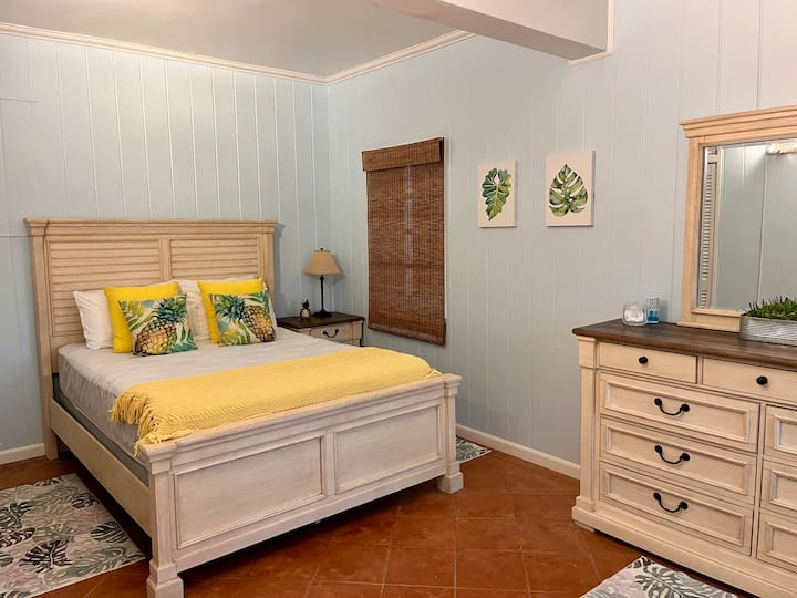 Lower-Level Guest Suite
Cozy bedroom with a queen-size bed and hotel-quality linens. Separate A/C keeps you comfortable, and a coffee station lets you enjoy a relaxing morning while watching the sunrise.