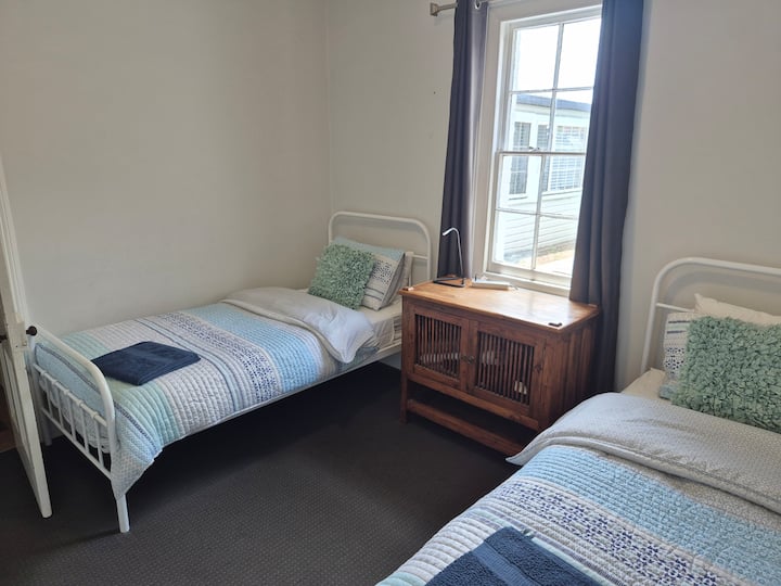 Bedroom 2. 2 new singles in a sunny room