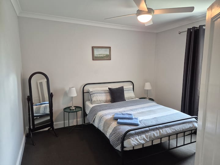 Large 4th Bedroom with a comfortable Queen bed, wardrobe and ceiling fan