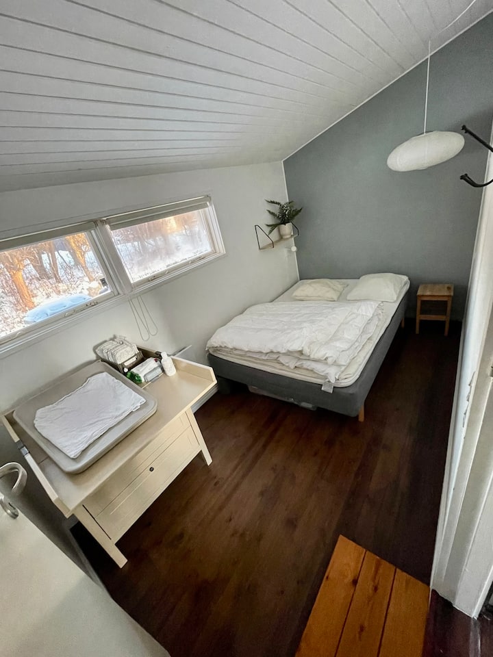 Bedroom with double bed and dresser that can be made into a changing area. 