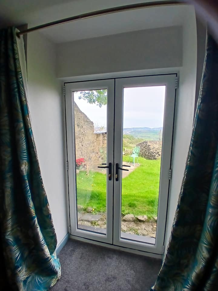 Patio doors open onto the lawn