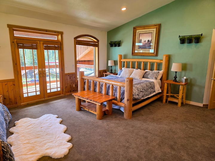 In the master, the oversized log king bed is fit for a king.