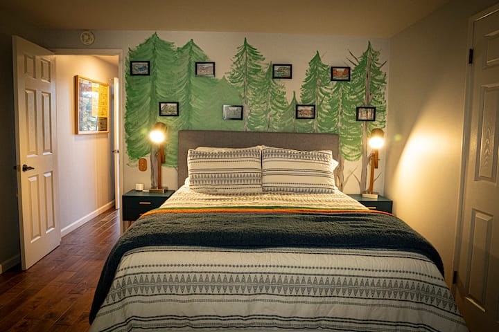 Queen bedroom on the main floor with the TV Room, Living Room, Kitchen and bathroom right outside this hallway. Also has walk in closet