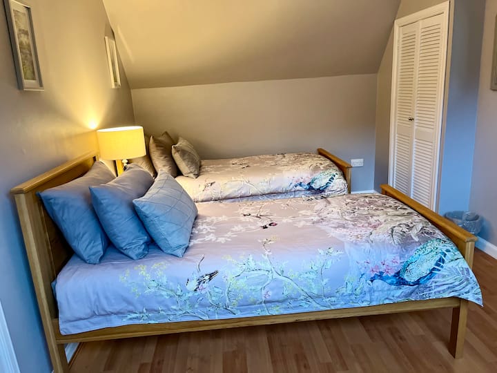 Beautiful oak beds in the twin bedroom.