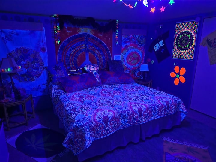 King bed in blacklights.