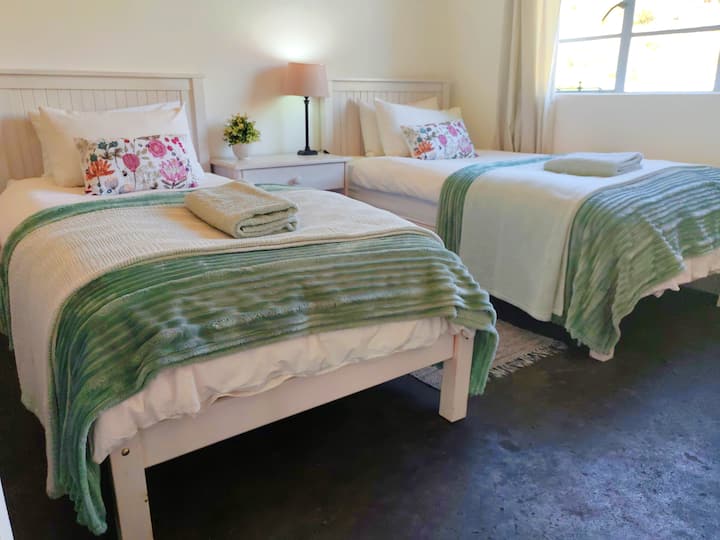 Two single beds in the second bedroom.