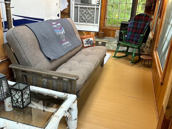 The large futon folds down to a double bed. High-speed satellite WiFi is located here. 