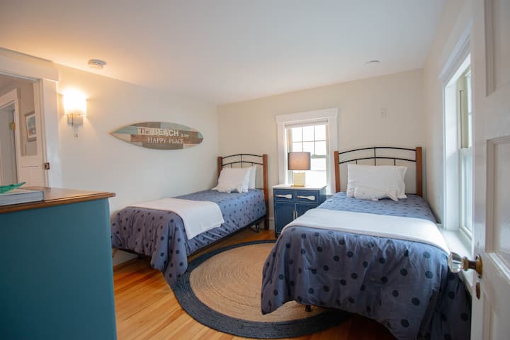 Comfortable second-floor bedroom with two twin beds.