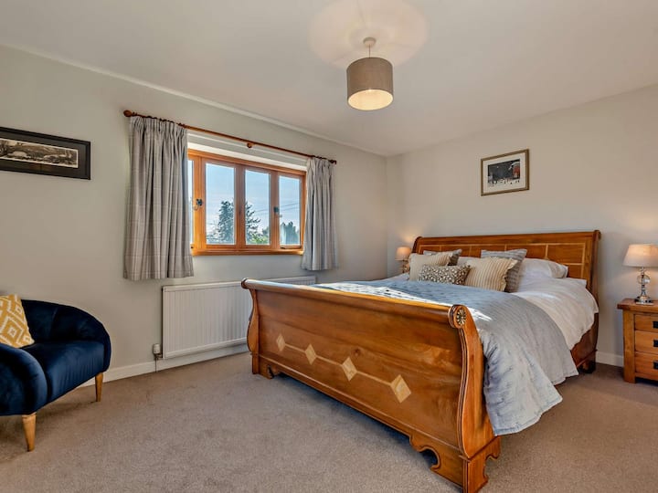 Master bedroom with modern en-suite shower room and wardrobe. 