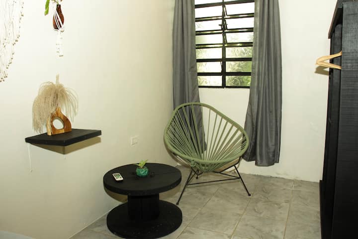 Enjoy this pleasant space inside the apartment.

Enjoy the wonderful, cozy Acapulco chair inside.