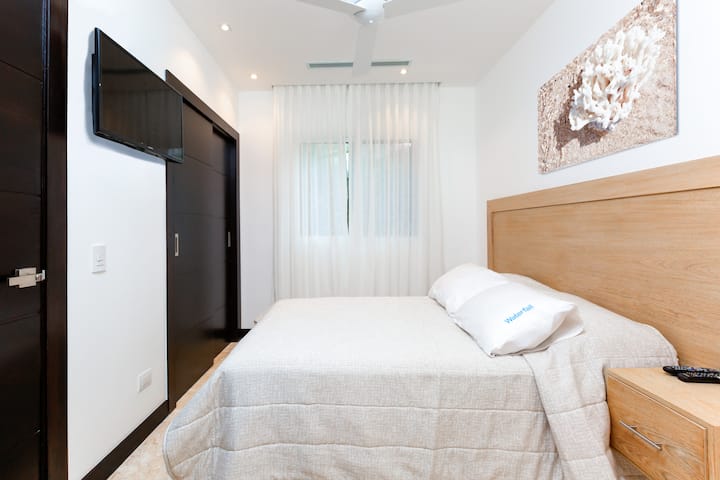 The 6th bedroom with a comfortable queen-size bed, designed for peaceful and relaxing nights.