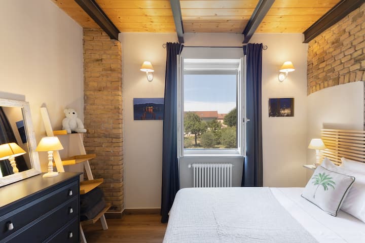 There are two single beds furnished with Emma mattresses which we can join to create a very large double bed if required. With a large window view of the surrounding countryside.