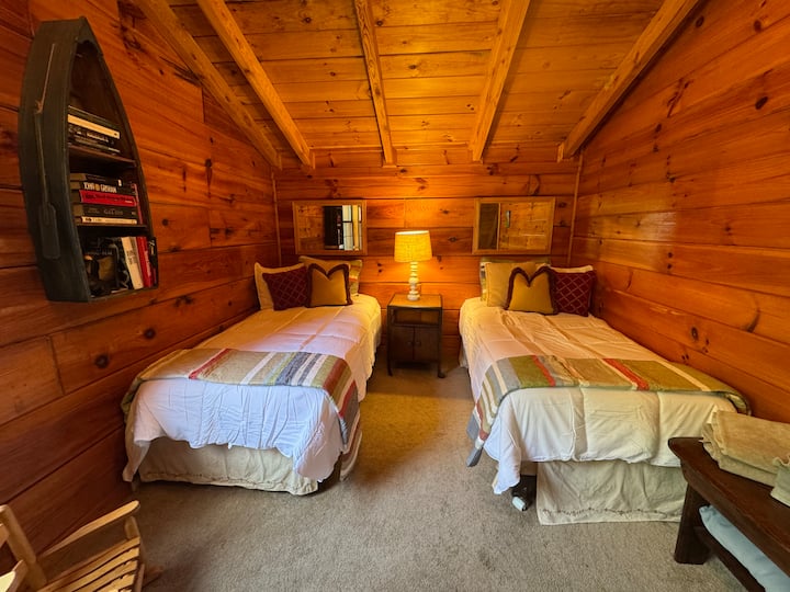 In addition to the three bedrooms, there is a “sleeping loft” with two twin beds upstairs with the master.