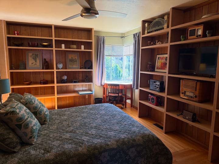 The 3rd bedroom is upstairs between the master bedroom & dining room. It features a small work area as well.
