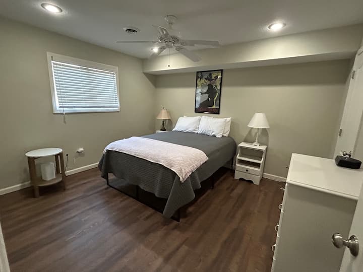 Queen-sized bed with dresser and closet