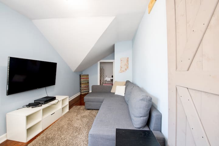 Laundry room upstairs with W/D available for your use. Intended to be a bonus room to let groups spread out and watch TV/play video games upstairs. Couch pulls out to a comfy queen bed and sheets/pillows are available for this room as well.