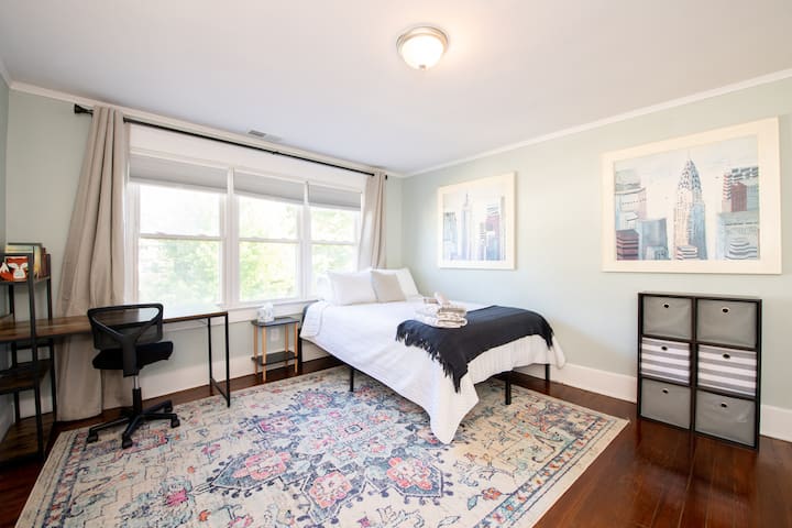 Queen bed, upstairs, front of home facing the street. 