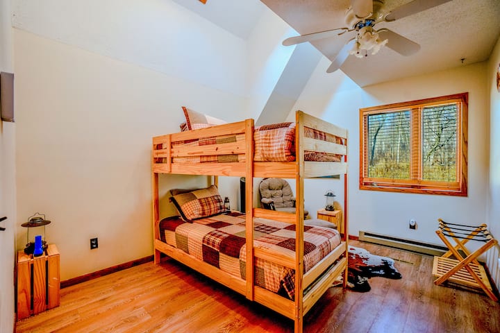 Main Level Bedroom 1 - Cozy bedroom featuring a twin-over-twin bunkbed for ample sleeping space.