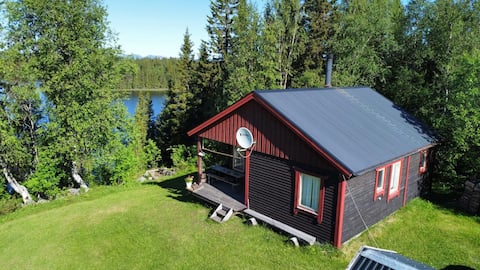 Swedish house by the lake with reindeer as neighbors