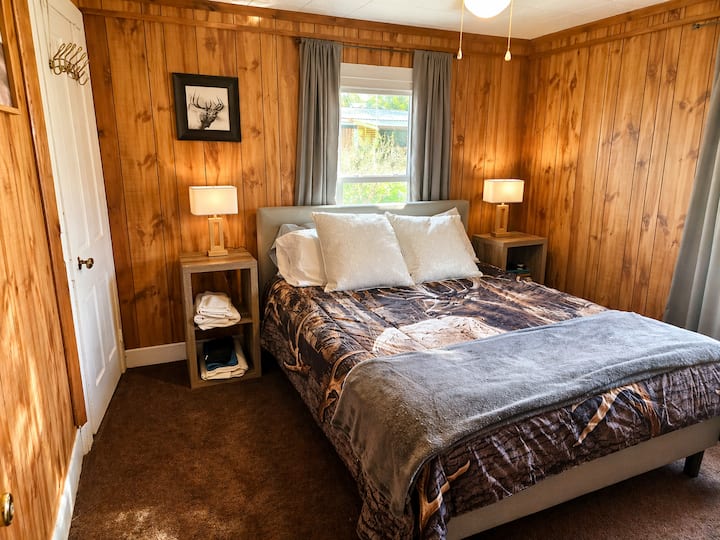 Relax upstairs in our Elk-themed Queen Bedroom.