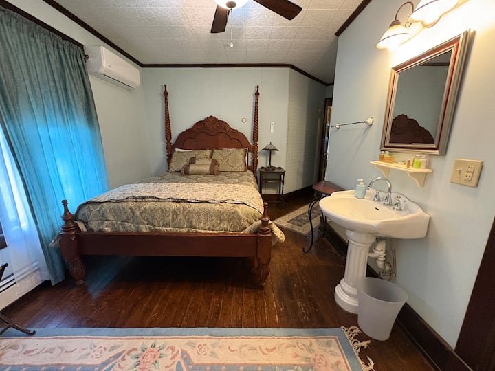 Youghiogheny River Bedroom  with queen bed, AC window unit, ceiling fan and private bathroom.