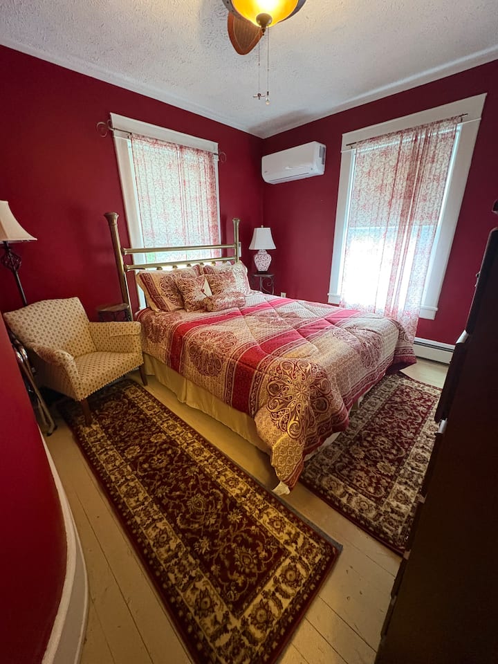 Affectionately known as the "Red Room", this is a quiet room on the back of the house with a queen bed, ceiling fan, and in-room mini-split. Shares the hallway bathroom.