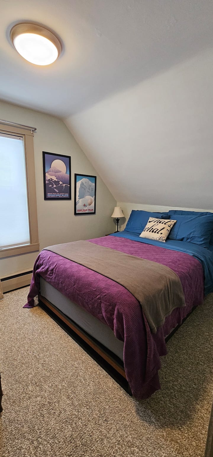 Small second floor bedroom. One double (full sized) bed, innerspring hybrid mattress, moderate -soft.