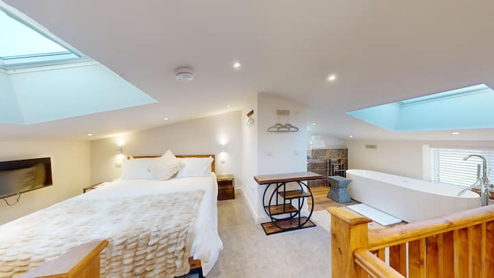 Mezzanine bedroom with bath, toilet & sink