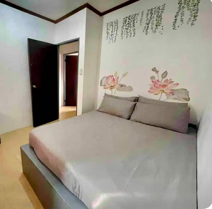 Queen size bed with aircon  and wardrobe