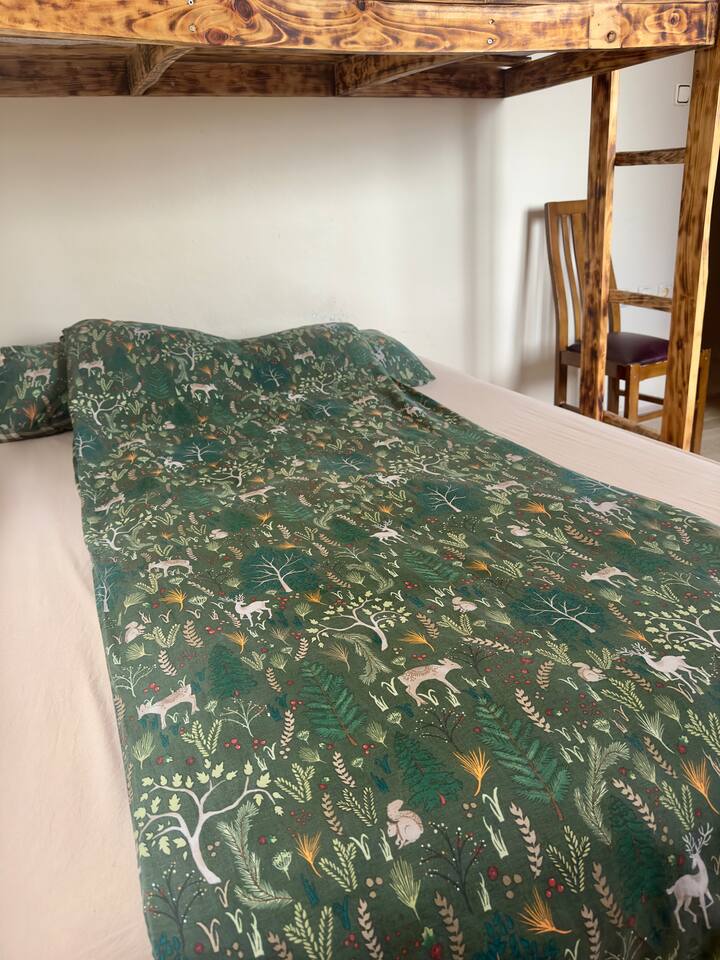 There is one double bed and a single bunk bed. 