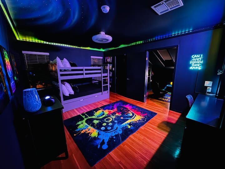 Gamer’s Getaway: Spacious Room with Game-Themed Fun!

Level up your stay in this video game-themed bedroom, perfect for families or groups! This spacious room features two cozy full size bunk beds plus a twin trundle bed for extra sleeping space.