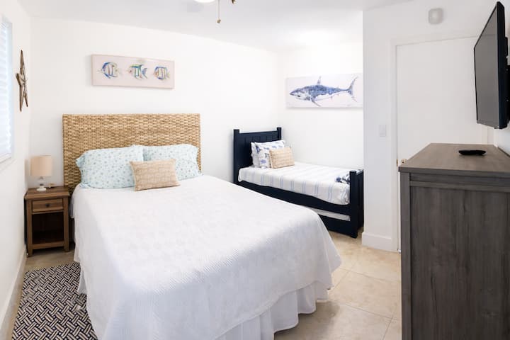 Guest bedroom with New queen Tuft & Needle bed plus New Zinus cooling memory foam twin w/trundle to sleep a family of four comfortably! 