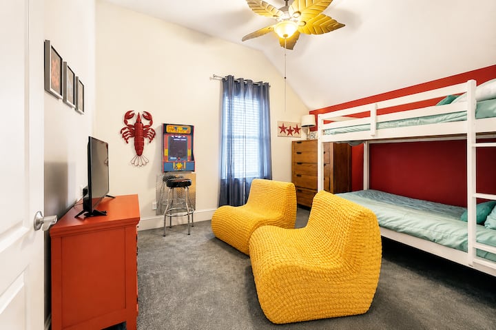 Let the adventures begin in our playful bunk room! ⚓️ With twin bunks for restful nights and a Roku TV plus pac-man arcade game for endless entertainment, this cozy hideaway is a kid's dream come true.