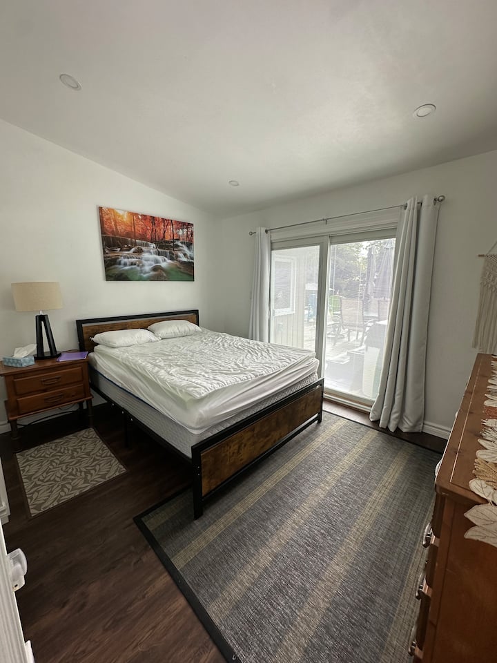 Master bedroom with sliding doors to riverside patio and hot tub 
Ensuite bathroom
Electric fireplace during the winter
Linens not included, mattress cover, pillows and pillow covers are included 