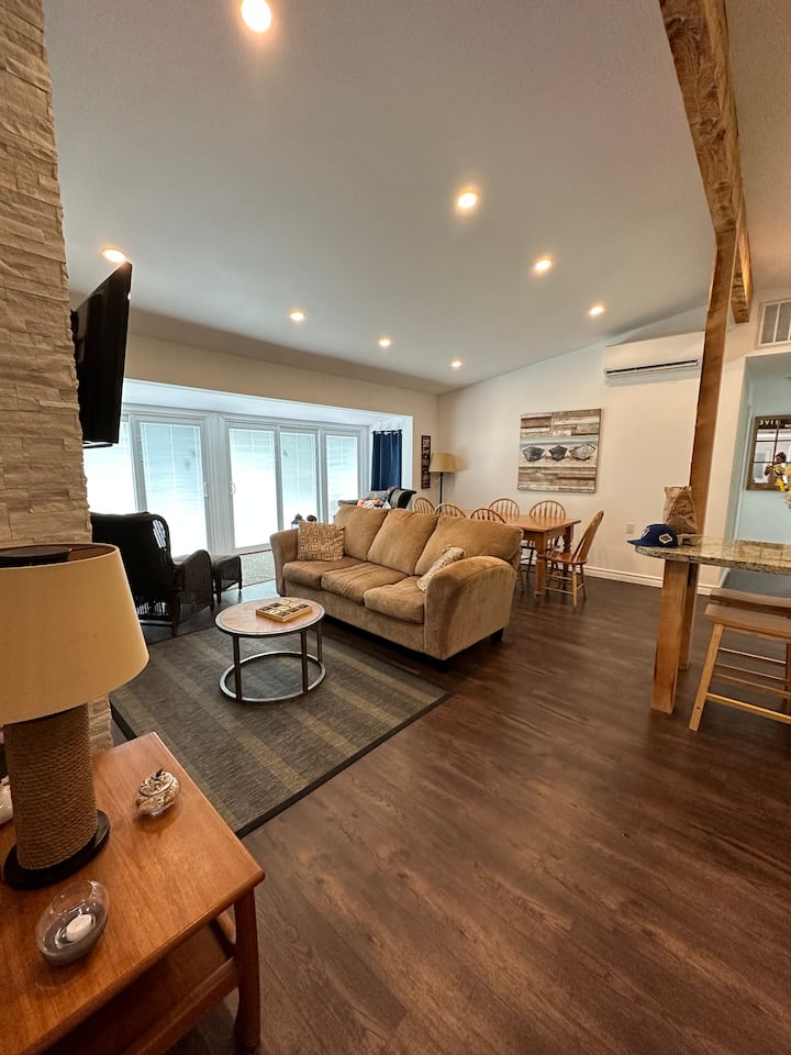 Living room - satellite tv, starlink WiFi for Netflix etc, 3 drawers of movies for the dvd player. Cedar chest filled with board games and puzzles. 
Propane fireplace for chilly nights (electric fireplace in the master bedroom during the winter)