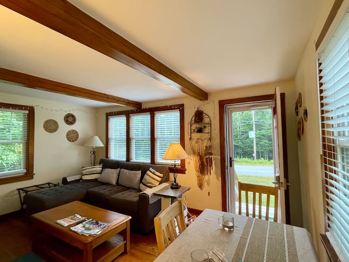 Light bright living room with eastern exposure is so lovely with the front door open when the weather is good! 