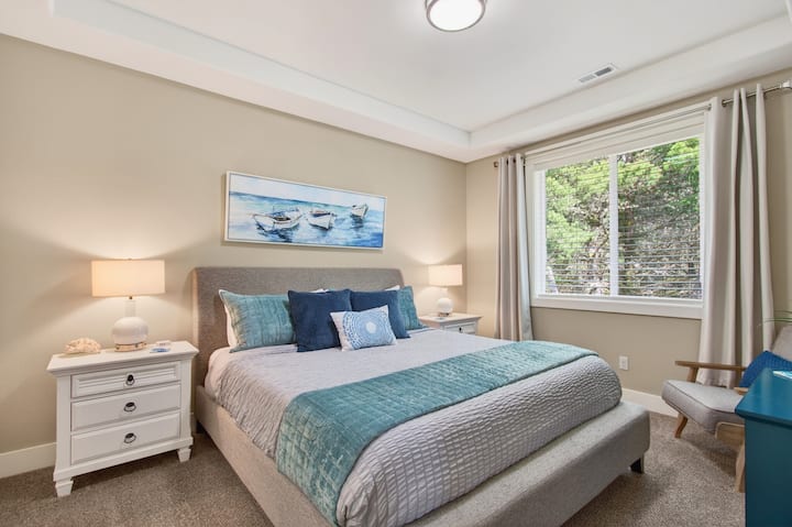 The primary bedroom features a plush King-sized bed for a restful night’s sleep.