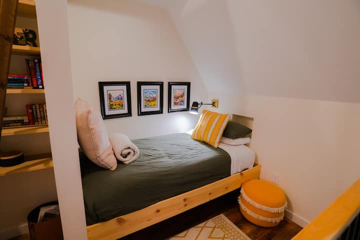This twin bed sits in the library / workspace at the front of the loft overlooking the conversation pit below